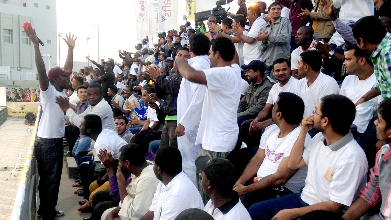 In Qatar, migrant workers paid to be sports 'fans'